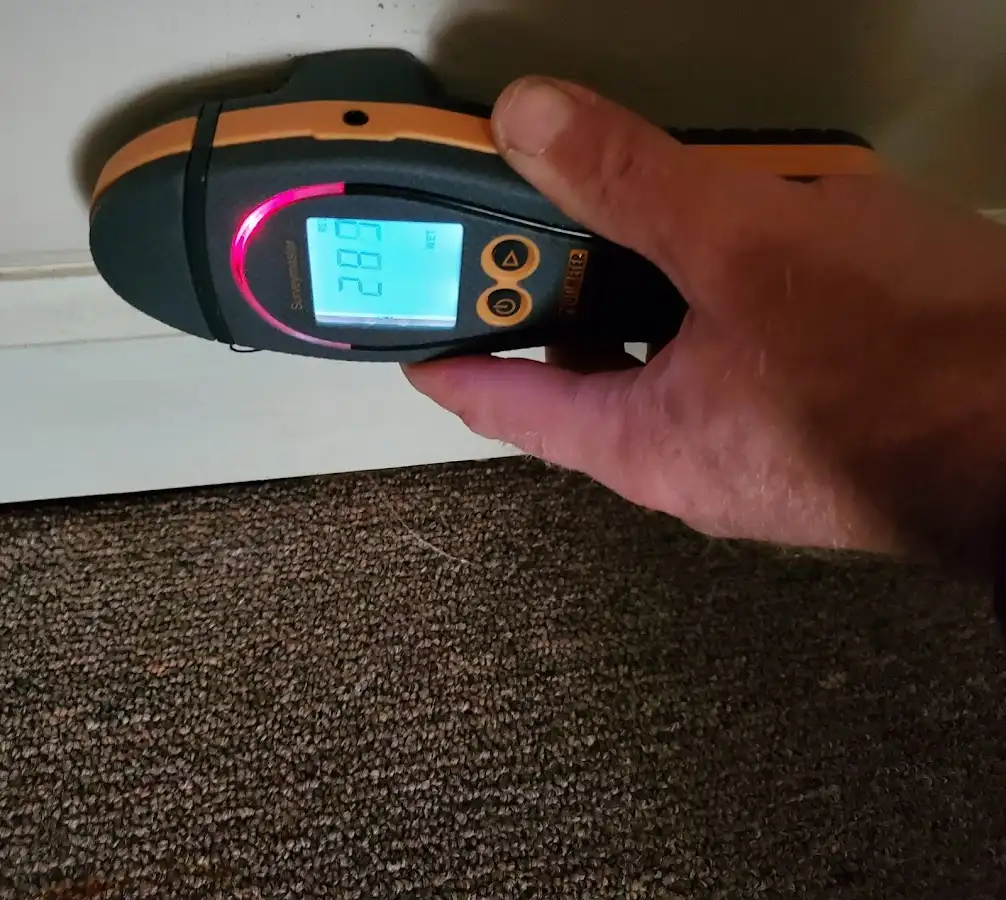 Moisture detection at baseboard during Storm Damage Restoration in Westfield